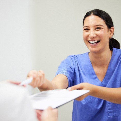 Patient in Chicago talking to dental staff about Invisalign