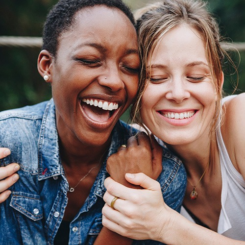 Patients in Chicago smiling after teeth whitening